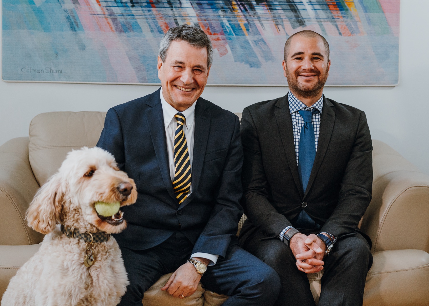 Stephen and Joshua Cheifetz with office dog